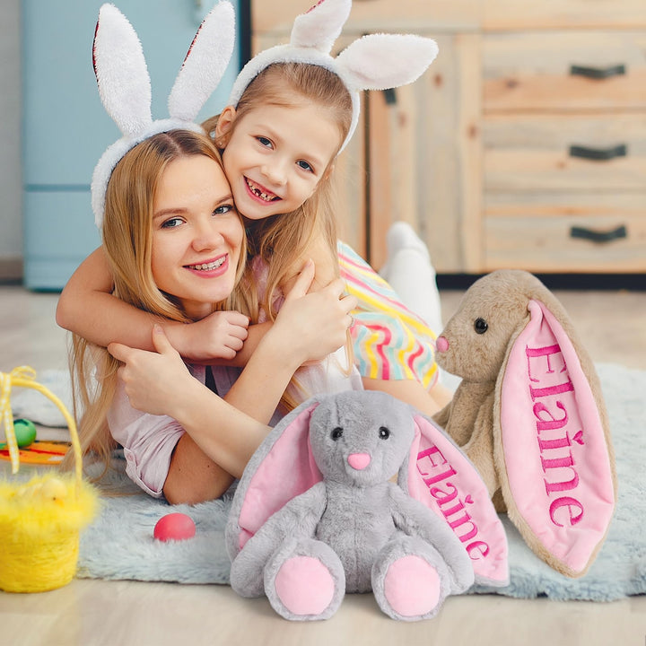 Personalized embroidered plush bunny with child's name, featuring a girl and her mother playing together.