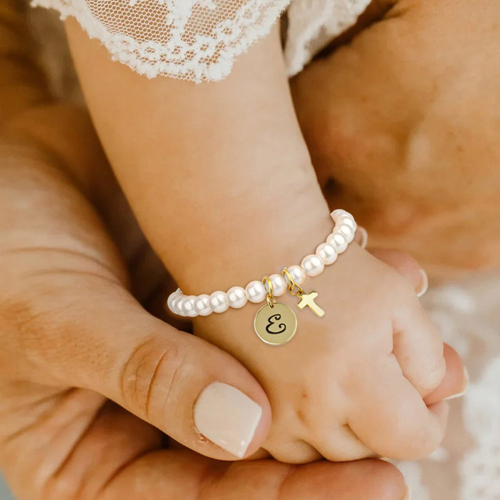 Gold baby pearl bracelet with cross and initial charm