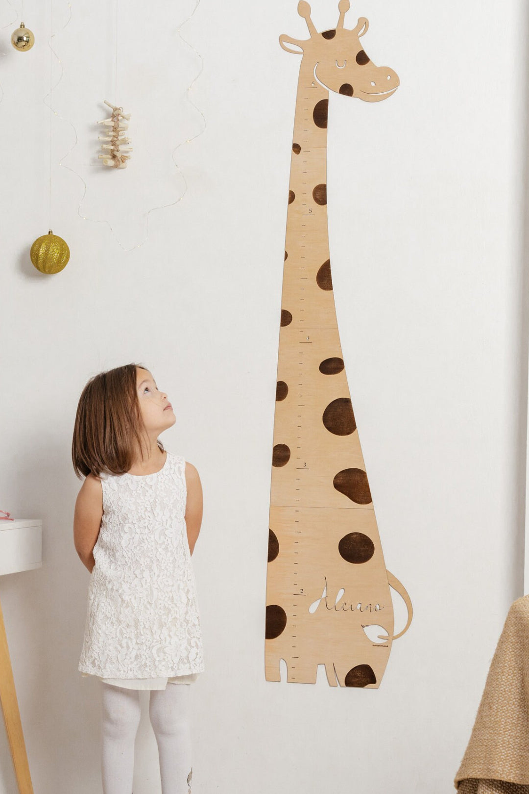 Personalized Wooden Giraffe Baby Height Growth Chart and a girl